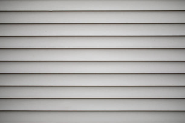 Grey or tan vinyl siding on a building